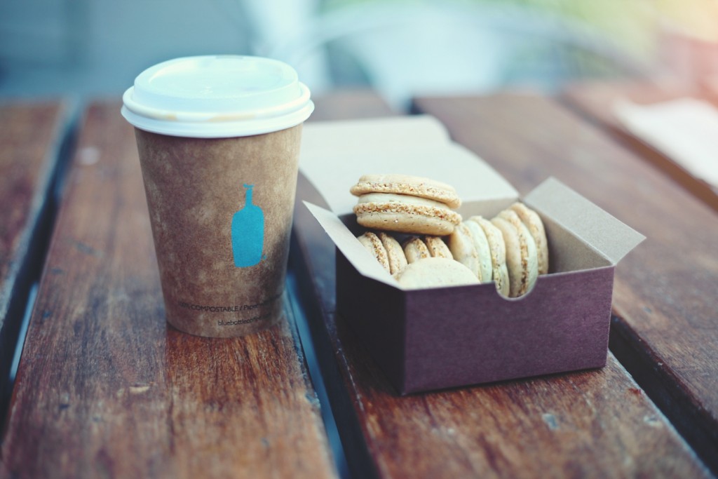 Image of a disposable coffee cup and macaroon box