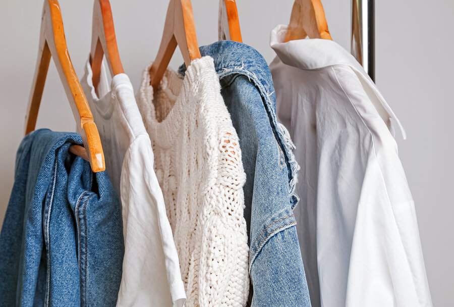clothes hanging on rail for capsule wardrobe