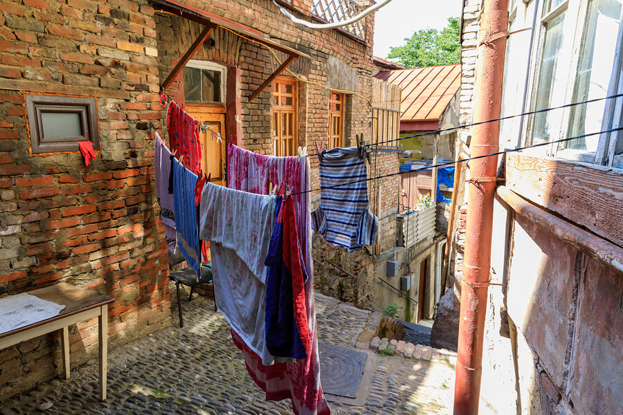 clothes hanging on a washing line outside a house