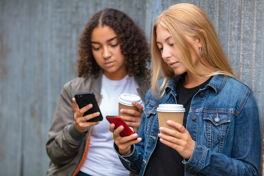 friends holding takeaway coffee cups