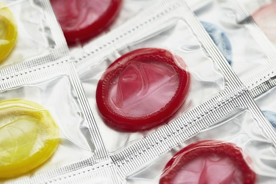 colourful condoms in their packaging