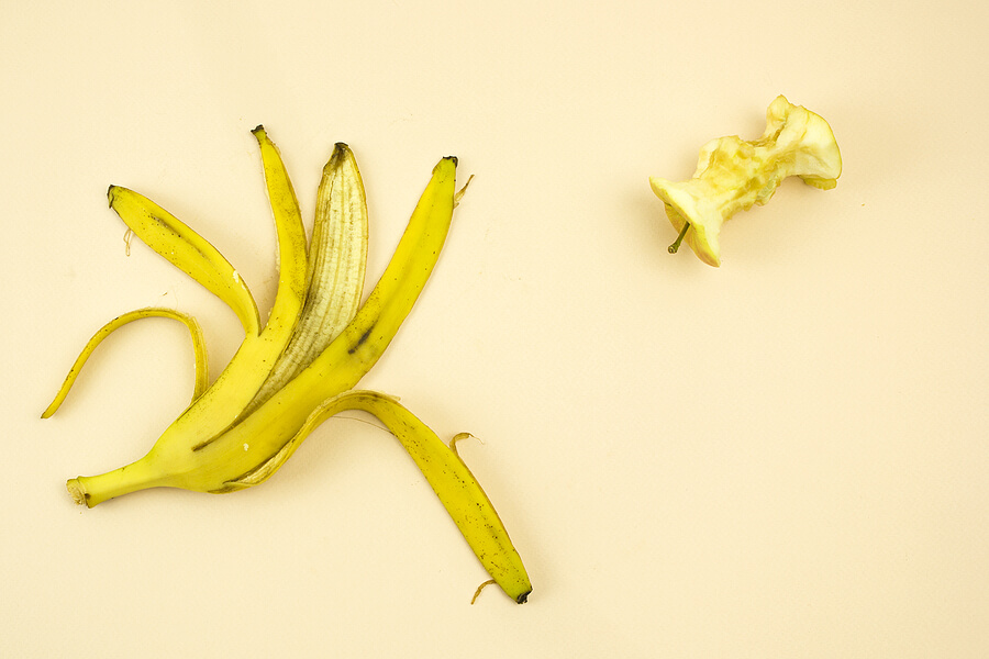 Banana skin and an eaten apple.