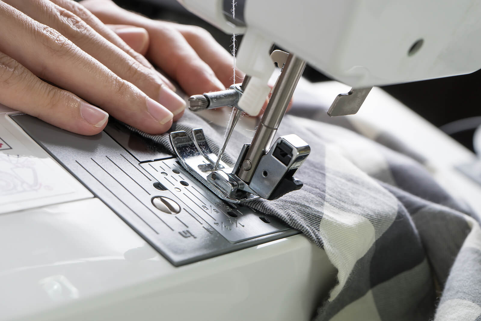 A close-up shot of a sewing machine in use.